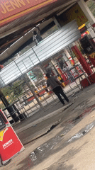 Workers repair damaged roof at Nigerian gas station