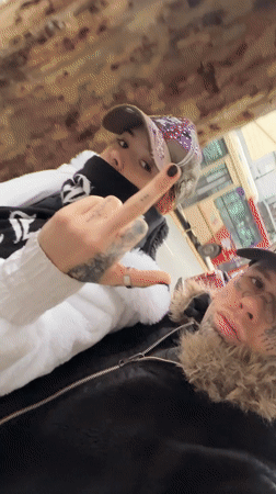 Tattooed individuals documented walking Buenos Aires streets near graffiti