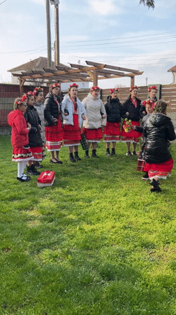 Young dancers in traditional costumes gather in Bulgarian village