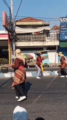 Traditional street parade winds through Tanjung Anom, East Java