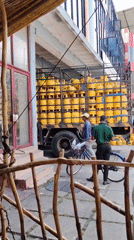 Morning commercial activity: propane delivery, fruit market operations observed