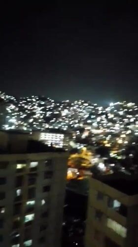 Caracas residents document nighttime city views and indoor moments
