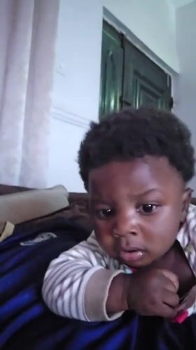 Quiet moment with a baby resting in Jos, Nigeria
