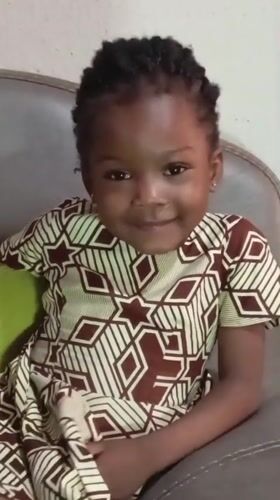 Smiling portrait on a couch in Jos, Nigeria