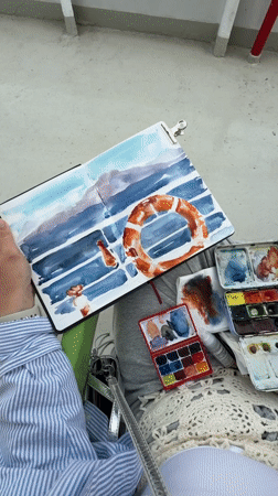 Artist paints watercolor maritime scene aboard ferry near Aegina