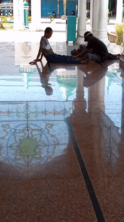 Morning prayers and plaza life at Lhokseumawe's grand mosque