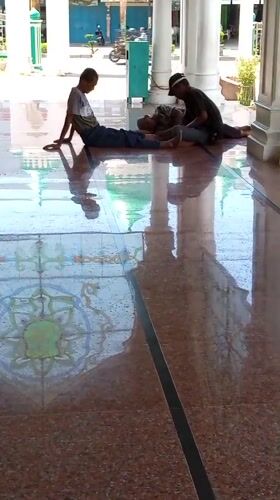 Morning prayers and plaza life at Lhokseumawe's grand mosque