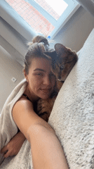 Woman shares quiet moments with Bengal cat indoors
