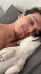 Man photographed relaxing with small dog in Sofia