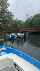 Boats spotted near decorated red bridge in Lukovit, Bulgaria