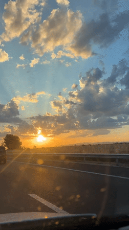 Highway drive at sunset with a waterside stop