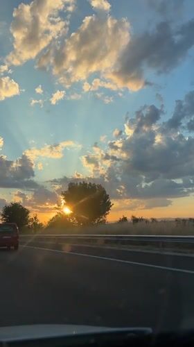 Highway drive at sunset with a waterside stop
