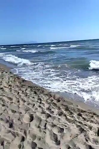 Beach memories captured in Mondragone, Italy during afternoon