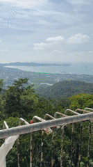 Tourist documents Big Buddha site views in Karon, Thailand