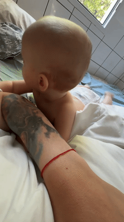 Baby moments on a bed in Sochi, up close.