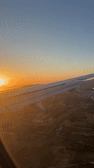 Aircraft filmed during sunset flight over Markopoulo, Greece