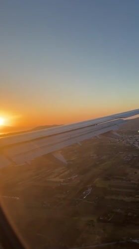 Aircraft filmed during sunset flight over Markopoulo, Greece