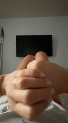 Woman observed in bedroom reaching toward window in Baranovka