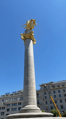 Golden equestrian monument documented in Tbilisi under clear skies