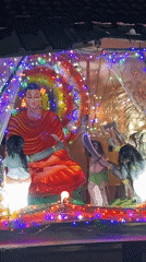 Illuminated Buddhist shrine displays observed in Sri Lankan towns