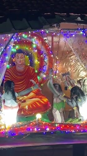 Illuminated Buddhist shrine displays observed in Sri Lankan towns
