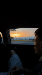Young man observed as passenger in moving car, Liangjiang