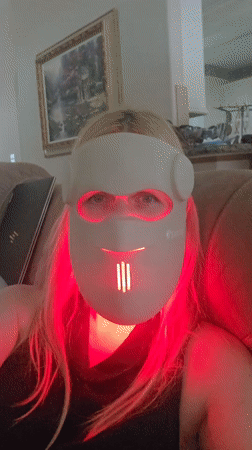 Red-light face mask routine at home, cats included