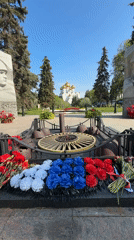 Woman photographs war memorials during Rusanovo gathering