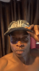 Young man documents selfie session with LED lights in Bukuru