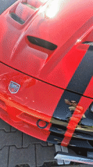 Sunny afternoon car show featuring muscle cars and exotics
