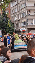 Costumed parade floats draw crowds in Gabrovo Bulgaria