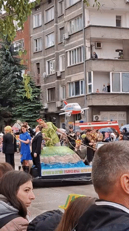 Costumed parade floats draw crowds in Gabrovo Bulgaria