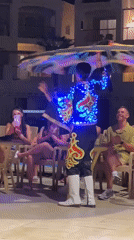 Tanoura dancers spin for a seated crowd in Sharm El Sheikh