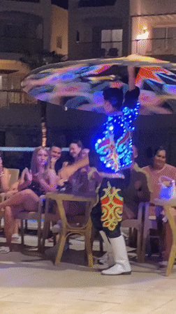Tanoura dancers spin for a seated crowd in Sharm El Sheikh