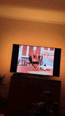 Evening TV viewing amid urban residential nighttime scene