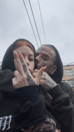 Young couple walks through Buenos Aires on overcast autumn evening