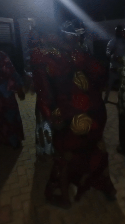 Three women dance together under lights in Tsaunin Kura