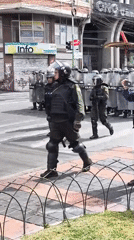Riot police deploy in formation on La Paz streets