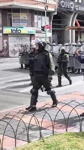 Riot police deploy in formation on La Paz streets