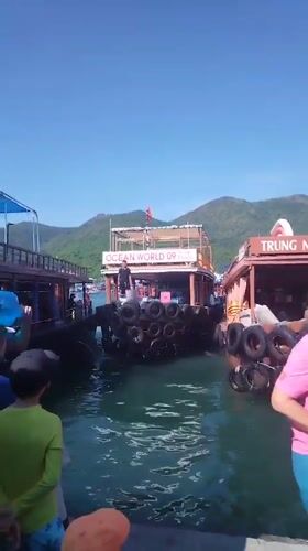 Morning ferry and tour boat activity at Nha Trang harbor