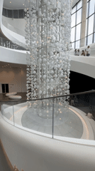 Exploring a modern museum with wine history exhibits and striking interior art