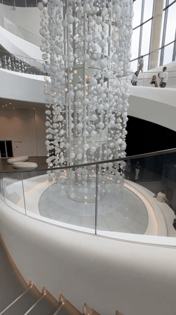 Exploring a modern museum with wine history exhibits and striking interior art