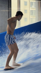 Indoor surf simulator session at a Jing'an wave pool