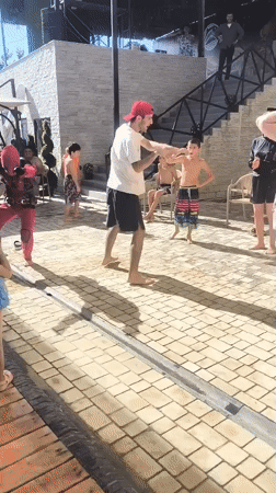 Costume characters and dancing at an outdoor party in Vahdat