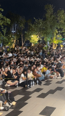 Bangkok night crowd gathers near Amari hotel