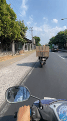 Open-road motorcycle ride under clear skies in East Java