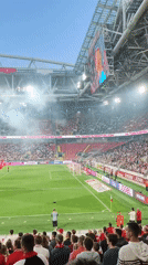 Red-clad crowd fills stadium for a charged soccer matchday