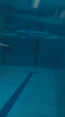 Underwater pool session in Markovskii, lanes and swimmer visible