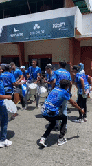 Street drummers parade through Venezuelan town drawing crowds