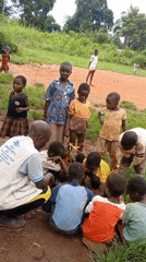 Adult leads educational activities with children in rural Congo villages